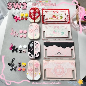 May include: A SW2 gift bundle featuring four sets of gaming console protective cases and matching accessories. Each set includes a console back plate, two controller covers, and small charms in red, pink, black, and light pink color themes.