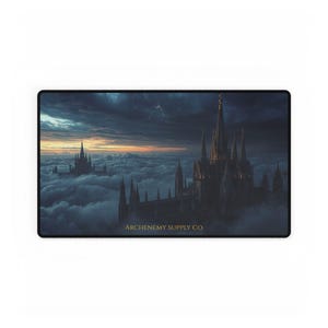 May include: Rectangular mousepad featuring a fantasy castle scene with spires rising above the clouds under a stormy sky. The text "ARCHENEMY SUPPLY CO." is printed in gold at the bottom.