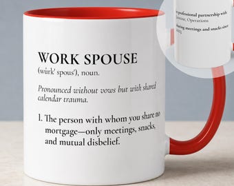 May include: A white ceramic mug with a bright red interior and handle. The front features black text defining WORK SPOUSE as a person with whom you share no mortgage, only meetings, snacks, and mutual disbelief. A circular inset shows the reverse side.