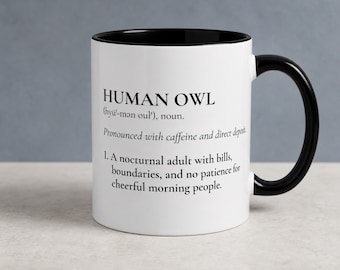 May include: A white ceramic mug with a black interior and a black handle. The mug features black printed text that reads: HUMAN OWL (hyü-mən oul), noun. Pronounced with caffeine and direct deposit. 1. A nocturnal adult with bills, boundaries, and no patience for cheerful morning people.