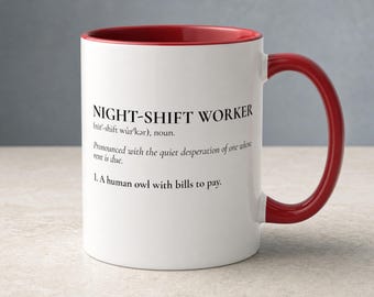 May include: A white ceramic mug with a red interior and handle. The front features black text that reads: NIGHT-SHIFT WORKER (nit'-shift wûr'kər), noun. Pronounced with the quiet desperation of one whose rent is due. 1. A human owl with bills to pay.