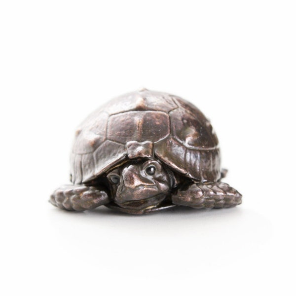 Tortoise hatchling with head tucked in. Open edition bronze.