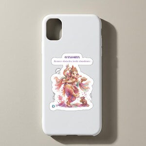 May include: A white smartphone case featuring a colorful illustration of Ganesha dancing with a small mouse. The text GANESHA and Remove obstacles, invite abundance is printed above the figure in a purple font. The design has a watercolor aesthetic.