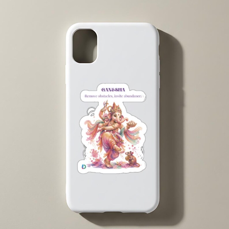 May include: A white smartphone case featuring a colorful illustration of Ganesha dancing with a small mouse. The text GANESHA and Remove obstacles, invite abundance is printed above the figure in a purple font. The design has a watercolor aesthetic.
