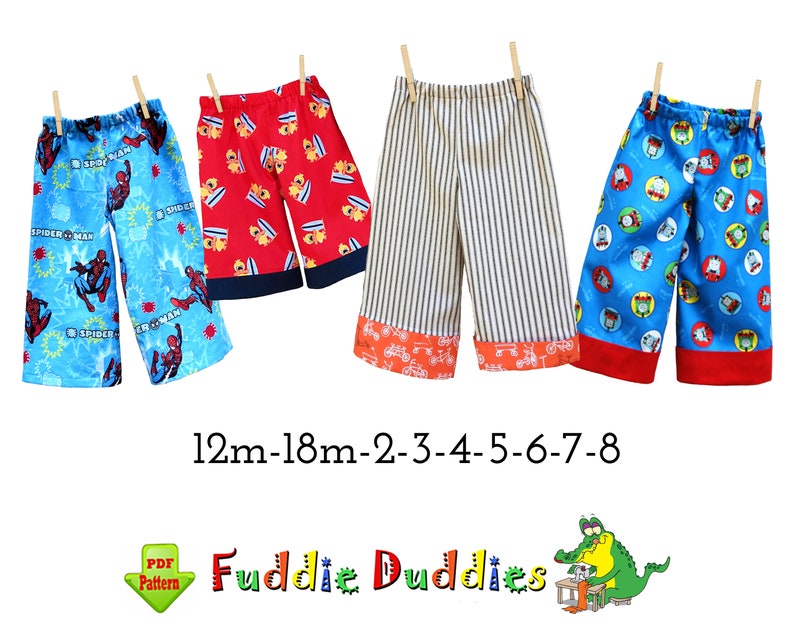 May include: Five pairs of colorful children's pants with different patterns. The pants are made of cotton fabric and have elastic waistbands. The sizes are 12m-18m, 2, 3, 4, 5, 6, 7, and 8. The text "Fuddie Duddies" is written below the pants.