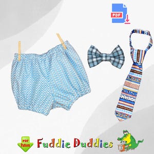 May include: A PDF pattern for a baby outfit, featuring a blue and white chevron print diaper cover, a blue and white plaid bow tie, and a colorful striped tie. The pattern is available for download from "Fuddie Duddies".