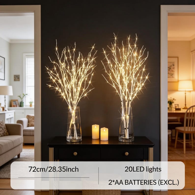 May include: Two decorative lighted birch branch arrangements in clear glass vases. Each arrangement has 20 LED lights. The branches are 28.35 inches (72cm) tall. Two battery-operated candles sit in front of the vases on a black table.