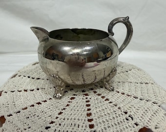 Vintage F.B. Rogers silver-plated creamer with footed base