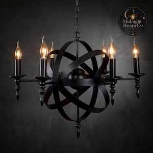 May include: A matte black orb chandelier featuring six candle-style lights arranged on curved arms. The central structure consists of intersecting metal bands forming a spherical cage. The fixture hangs from a chain and includes a logo reading Midnight Beam Co.