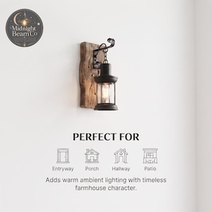 A black lantern wall sconce on a reclaimed wood backing, styled in a hallway setting with neutral walls and warm ambient light, demonstrating the compact and space-saving design ideal for narrow entryways and corridors.