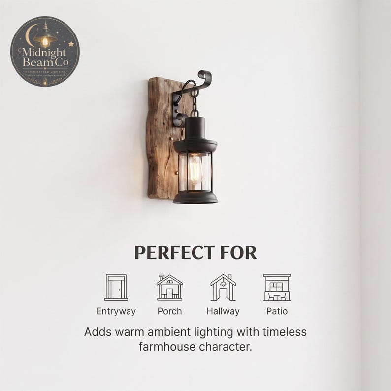 A black lantern wall sconce on a reclaimed wood backing, styled in a hallway setting with neutral walls and warm ambient light, demonstrating the compact and space-saving design ideal for narrow entryways and corridors.
