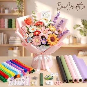 May include: A bouquet of crocheted flowers in pink wrapping paper with a white ribbon, featuring tulips, lilies, daisies, and sunflowers. Beside it are colorful pipe cleaners, rolls of wrapping paper, floral wire, tape, and scissors.