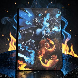 May include: A rectangular protective case featuring a vibrant graphic illustration of three dragon-like creatures. A large dark creature breathes blue flames, while two smaller orange creatures with fiery tails are positioned below it.