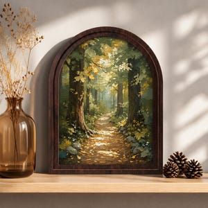 May include: An arched wall art print featuring an oil painting of a forest path with tall trees, dappled sunlight, and fallen yellow leaves. The artwork is encased in a dark brown wooden frame, displayed alongside a glass vase and pinecones.