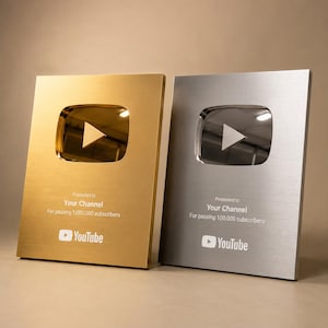 May include: Two YouTube Play Buttons, one gold and one silver, are shown. The gold award is for 1,000,000 subscribers, and the silver is for 100,000 subscribers. Each features a play button logo and the YouTube logo.