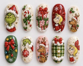 May include: A set of ten oval-shaped press-on nails featuring Christmas-themed illustrations including the Grinch, Cindy Lou Who, a dog with antlers, candy canes, wrapped gift boxes, holiday lights, and green plaid patterns with white snowflakes.