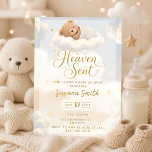 May include: Baby shower invitation with a soft, dreamy aesthetic. The design features a sleeping teddy bear on a cloud, with the words "Heaven Sent" in elegant gold script. Additional details include the honoree's name, date, time, and RSVP information.