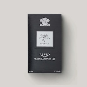 May include: A black rectangular perfume box with a textured surface. It features a silver crest at the top, a central white label with a winged horse illustration and the text AVENTUS, and the CREED logo with the text DE PERE EN FILS DEPUIS 1760.