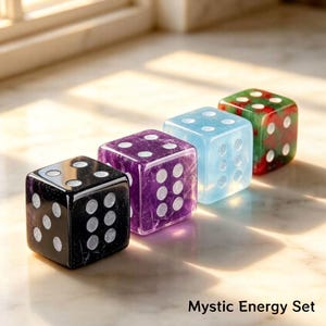 May include: Four colorful dice in a row. The dice are black, purple, light blue, and green with white dots. The text "Mystic Energy Set" is at the bottom of the image.