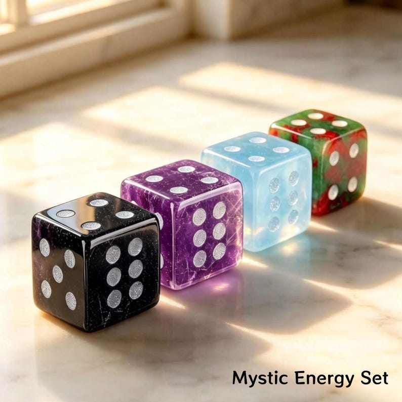 May include: Four colorful dice in a row. The dice are black, purple, light blue, and green with white dots. The text "Mystic Energy Set" is at the bottom of the image.