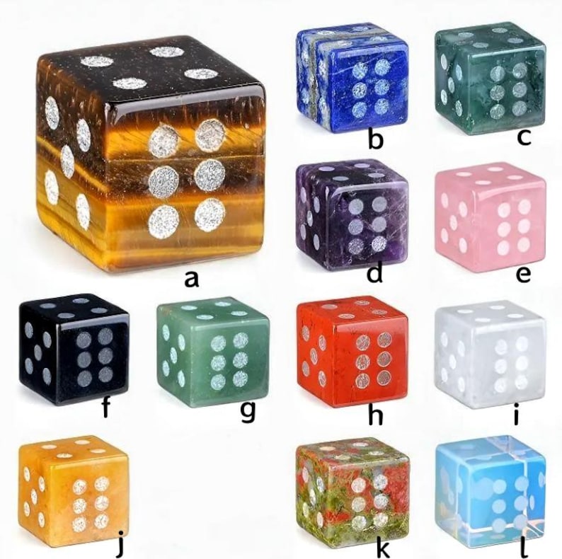 May include: A collection of twelve gemstone dice in various colors, including tiger's eye, blue, green, purple, pink, black, red, white, yellow, and a multi-colored option. Each die has white dots indicating the numbers.