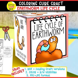 May include: A paper craft cube depicting the earthworm life cycle with cartoon illustrations of worms in orange and pink. The cube features text reading Life Cycle of Earthworm and Adult Worm, alongside a flat template sheet and scissors.