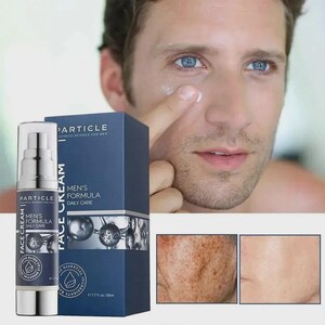 May include: A skincare product for men is displayed with a man applying the cream. The product is in a silver and navy blue bottle and box. The box reads "MEN'S FORMULA DAILY CARE" and "PARTICLE ESTHETIC SCIENCE FOR MEN". The image also shows before and after skin results.