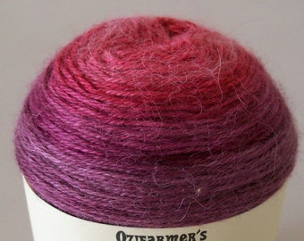 May include: A skein of yarn in shades of pink and purple, labelled "Ozifarmer's Market" and "Rapture".