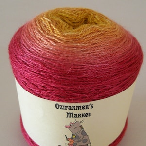 May include: A skein of yarn in a gradient of orange, yellow, and red colours. The yarn is labelled "Ozifarmer's Market Silky Lace".