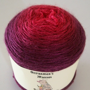 Cachemire Soie: 4ply Fingering Weight Wool, Silk, Cashmere blend gradient dyed red to burgundy yarn.  Colourway -Scarlett
