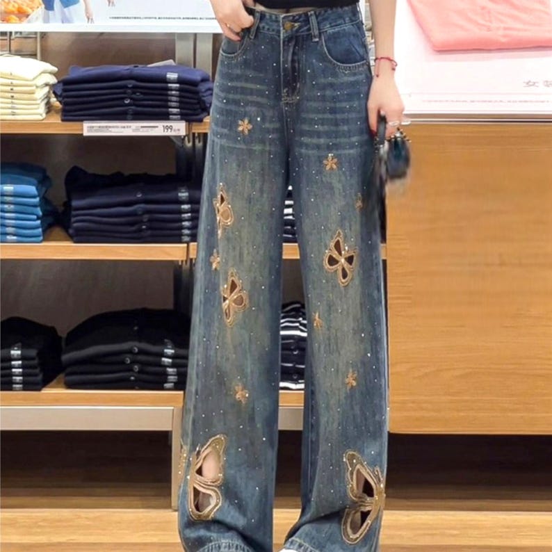 Cutout Embroidered Jeans | Wide Leg Denim Pants | Daily Wear | Y2K Streetwear Style

Wide leg denim jeans with butterfly embroidery and relaxed Y2K streetwear design