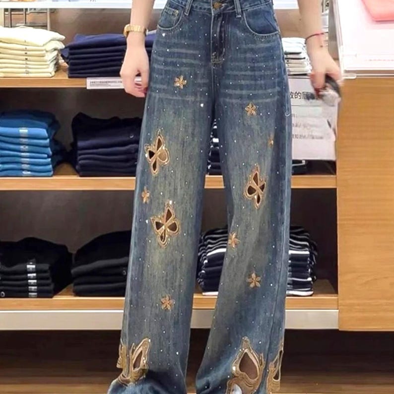 Cutout Embroidered Jeans | Wide Leg Denim Pants | Daily Wear | Y2K Streetwear Style

Wide leg denim jeans with butterfly embroidery and relaxed Y2K streetwear design