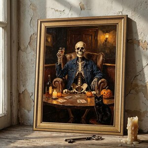 May include: A framed oil painting depicting a skeleton wearing a blue denim jacket, sitting in a leather armchair at a round table. The skeleton holds a glass of amber liquid. A black cat, small pumpkins, playing cards, and a bottle sit on the table.