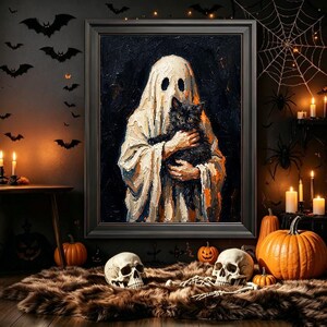 May include: A framed oil painting depicting a figure draped in a white sheet with dark eye holes, holding a black cat against a dark background. The artwork is displayed in a room decorated with pumpkins, skulls, candles, and wall bats.