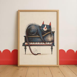 May include: A framed art print showing a black cat with red ears resting on a grand piano. The piano is dark blue with white keys. The artwork is set against a cream background, with a wooden frame.