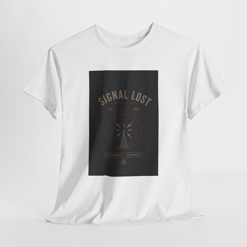 May include: White t-shirt with a black rectangular graphic. The graphic features the text "SIGNAL LOST" above a stylized radio tower design within a red circle. The shirt has short sleeves and a crew neck.