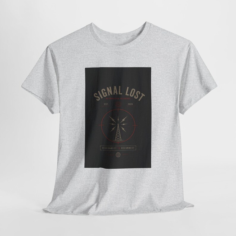 May include: A light gray t-shirt featuring a black rectangle with the words "SIGNAL LOST" in a vintage font. The design includes a radio tower graphic and the text "RECONNECT".