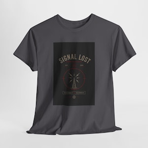 May include: Dark gray t-shirt featuring a rectangular graphic with the words "SIGNAL LOST" in a vintage font. The graphic includes a radio tower illustration within a red circle, with the text "DISCONNECT RECONNECT" below.