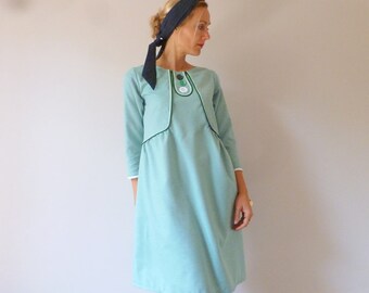 Pale green cotton dress with trimmings