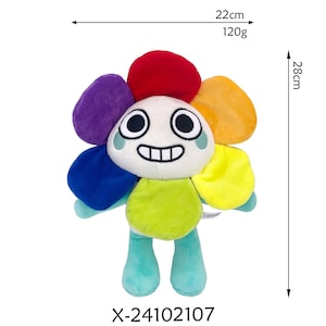 K&ouml;nnte beinhalten: Ein Pl&uuml;schtier in Form einer l&auml;chelnden Blume mit bunten Bl&uuml;tenbl&auml;ttern. Das Spielzeug ist 28 cm hoch und 22 cm breit und wiegt 120 g. Die Blume hat ein wei&szlig;es Gesicht mit schwarzen Augen und einem breiten Grinsen. Der Produktcode "X-24102107" ist aufgedruckt.