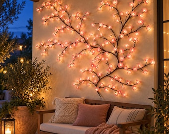 May include: A wall-mounted decorative light fixture shaped like a sprawling tree branch with numerous small, glowing pink cherry blossom flowers. The dark brown branches extend across the wall, illuminated by warm LED lights within each petal.