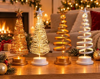 May include: Four decorative tabletop Christmas trees with star toppers and integrated string lights. Two trees feature coiled wire designs in gold and silver, while two feature flat ribbon-style spirals in gold and white on circular bases.