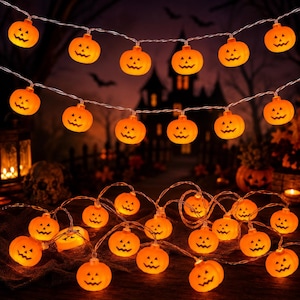 May include: A string of orange pumpkin-shaped LED lights featuring carved jack-o'-lantern faces. The small, glowing plastic pumpkins are evenly spaced along a thin, flexible wire, creating a festive illumination for seasonal decor.