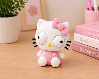 Cute cross-eyed cat figurine, adorable Kawaii-style desk decoration, fun cartoon cat figurine, pink bow-shaped shelf ornament