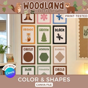 May include: A set of educational wall posters titled Woodland Collection featuring colours and shapes. Each rectangular poster displays a word and a corresponding graphic, including a fox for orange, a tree for green, a dragonfly for black, and various geometric shapes like circles, hexagons, rhombuses, stars, and pentagons.