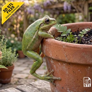 May include: A green frog figurine clinging to the side of a terracotta plant pot. The image includes a yellow banner with the text 3D STL FILES DIGITAL DOWNLOAD and a small white icon with the text STL in the bottom right corner.