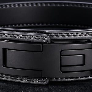 May include: A black weightlifting belt with a heavy-duty buckle. The belt is made of thick, stitched leather and features a series of evenly spaced holes for adjustment. The buckle is a matte black colour.