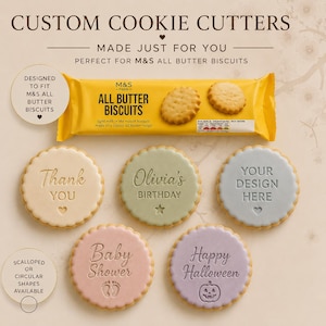 May include: Custom cookie cutters designed for M&S All Butter Biscuits. Five round, scalloped-edge cookies feature embossed text and icons: Thank You with a heart, Olivia's Birthday with a star, Your Design Here with a heart, Baby Shower with footprints, and Happy Halloween with a pumpkin.