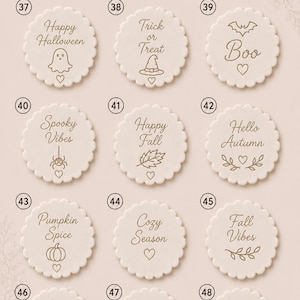 May include: A collection of twelve round, scalloped-edge white ceramic discs arranged in a grid. Each disc features brown engraved text and icons related to autumn and Halloween, numbered 37 through 48, with the header text RECENT ORDERS 4.