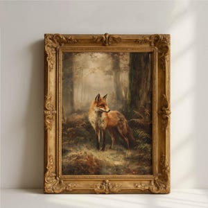 May include: A framed oil painting depicting a red fox standing in a misty forest. The fox has orange and white fur and is positioned among dark trees and ferns. The artwork is enclosed in an ornate, antique-style gold-colored frame.
